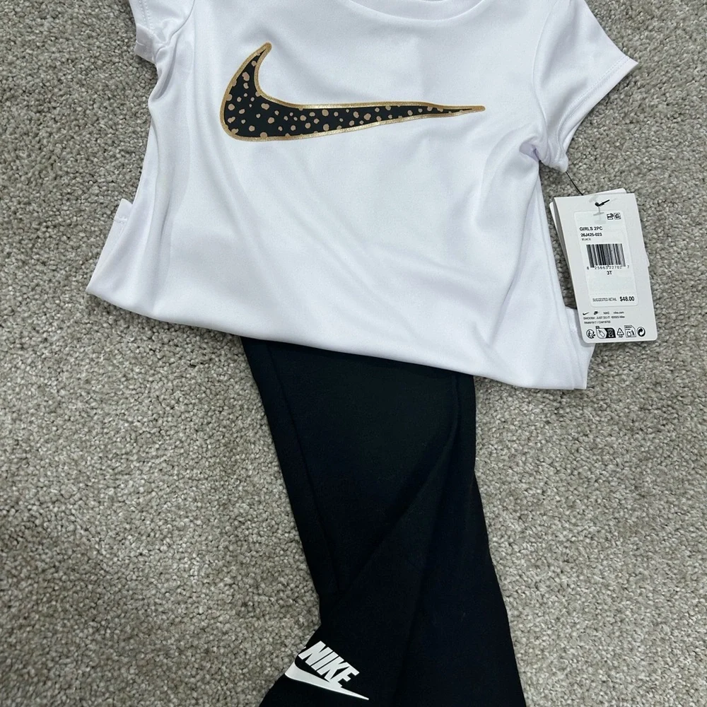 Nike 2-Piece Toddler Set - White Top with Gold/Black Swoosh + Black Leggings - Picture 2 of 2